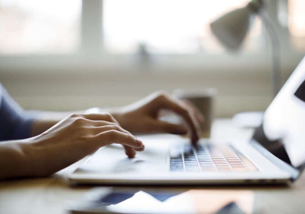 Woman using her laptop for working from home